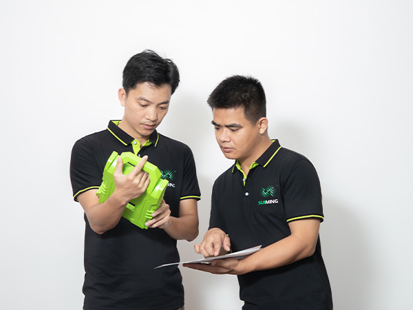 two engineers checking the led lighting mold for extra support