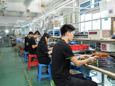 workers in led outdoor lighting drive manufacturing workshop